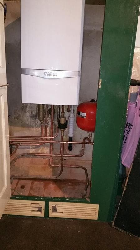 Boiler, expansion vessel and cylinder pipework installed by Home Comfort Assured Renewables in a plant cupboard